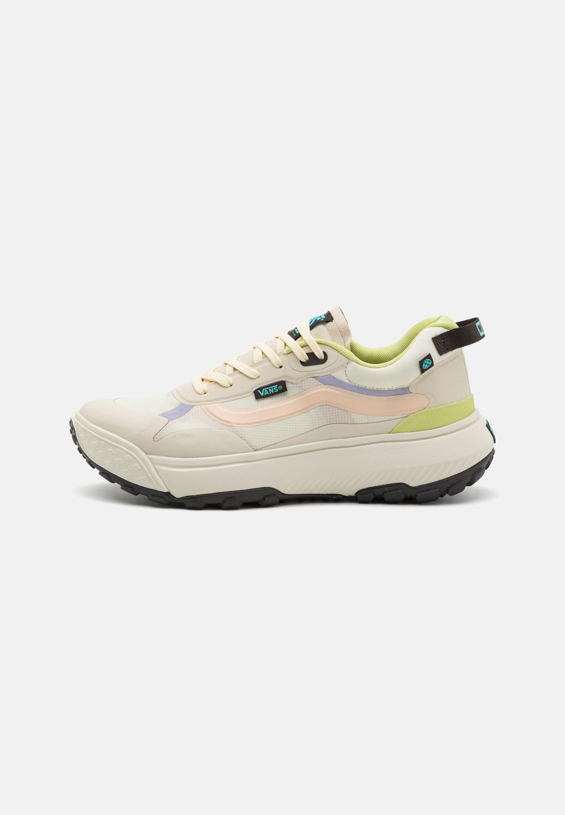 Cream-colored Vans sneaker with pastel pink and lavender accents, lime green lining, black sole, and pull tab on a white background.