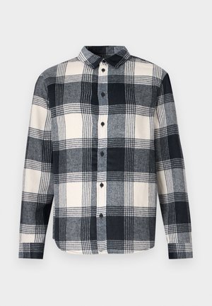 Flannel shirt with a navy, white, and grey plaid pattern. Features a collar, button closure, and long sleeves with a straight hem.