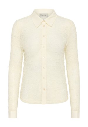 Cream long-sleeved shirt with a textured, floral pattern, full front button closure, and a classic collar. Soft fabric and fitted design.