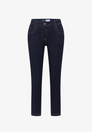 Granatowe, obcisłe dżinsy z denimu, z przednimi kieszeniami, szlufkami na pasek, zapięciem na guziki oraz subtelnymi detalami przeszyć.