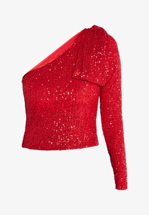 Crvena bluzica s cirkonima s jednim dugim rukavom, asimetričnom izrezom i prilagodljivom siluetom. Tekstura je sjajna i reflektirajuća.
