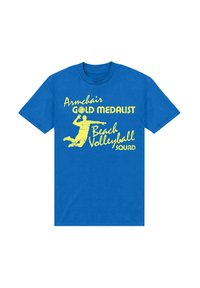 Camiseta de algodón azul con texto amarillo que dice "SQUAD de MEDALLISTAS de ORO en Voleibol de Playa" acompañado de una imagen de un jugador saltando.