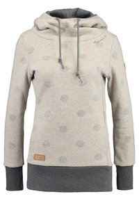 Beige hoodie med gråa prickar, dragsko i huvan, grå ribbstickade manschetter och nederkant, samt en liten brun patch på den nedre framsidan.