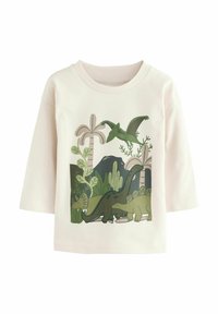 Langärmliges, hellrosa Shirt mit einem Dinosaurier-Graphic in grünen Akzenten, Pflanzen und einem strukturierten Rundhalsausschnitt. Aus weichem Baumwollmaterial.