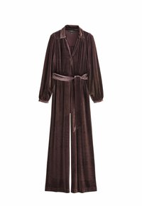 Plüschiger, tiefvioletter Jumpsuit mit langen Ärmeln, tailliertem Schnitt und Kragen; aus weichem Samtstoff gefertigt und mit weitem Bein designet.