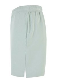 Light green cotton shorts with an elastic waistband, featuring side pockets and a hem with slits on both sides for added comfort.
