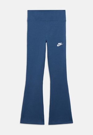 Blue flared athletic leggings made of stretchy fabric with a smooth texture. Features a white Nike logo on the left thigh.