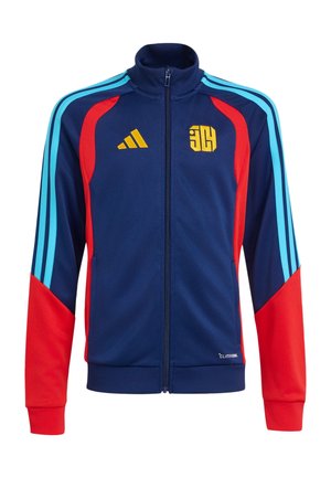 Granatowa sportowa kurtka na zamek z czerwonymi rękawami, jasnoniebieskimi paskami na ramionach i żółtymi logo na piersi.