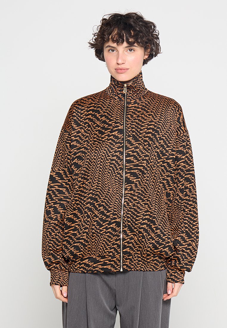 pinko Lichte jas oranje