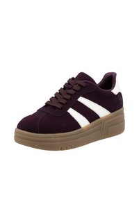 Purple suede sneaker with white stripes, round toe, thick gum rubber sole, and brown laces. Accented with a logo on the heel.