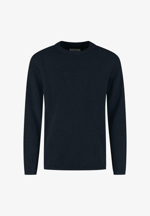 Navy blue long-sleeve sweater features a textured knit pattern, round neckline, and ribbed cuffs, offering a relaxed fit.