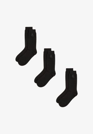 Črne bombažne crew nogavice z diskretno podrobnostjo logotipa. Oblikovanje je klasično, z gladko teksturo in ojačanim prstom ter peto.