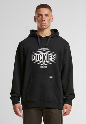 Black hoodie made of cotton blend, featuring a front pocket, drawstring hood, and a white logo with "QUALITY WORKWEAR" text.