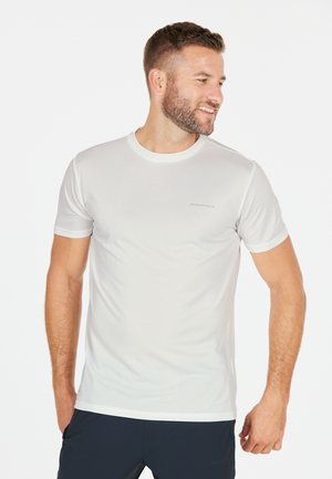 Valkoinen lyhythihainen urheilupaita, jossa on pyöreä pääntie, rinnassa on huomaamaton logo ja se on valmistettu sileästä, kevyestä materiaalista.