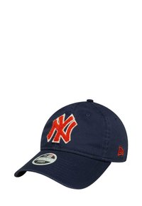 Navy blue cotton cap with a curved brim, featuring a large red and white embroidered logo on the front, and a small red accent on the side.