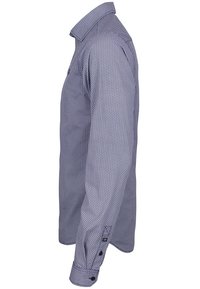 Long-sleeve button-up shirt with small geometric pattern in shades of blue, shown from the side against a white background.