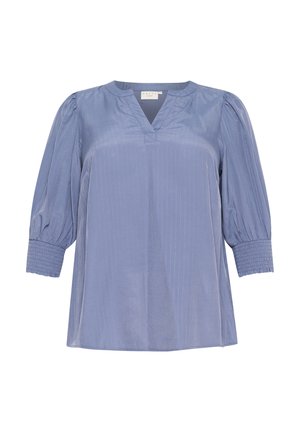 Zila blūze ar V veida dekoltē, puff piedurknēm un smockētām aprocēm. Iezīmes vertikālas svītras uz gludas auduma.