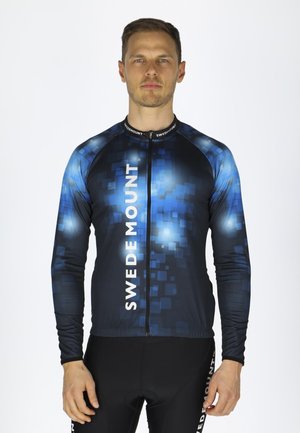 Long-sleeve cycling jersey in dark blue with a pixelated pattern, white logo text, and a full zipper. Made of stretchy, breathable fabric.