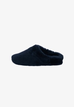 Navy blue fuzzy slipper made of soft fabric, featuring an open back design and textured surface for comfort and warmth.