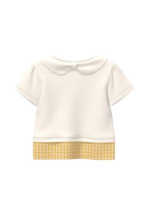 Biały top z krótkim rękawem, zaokrąglonym kołnierzem i żółtym wzorem w kratę na dole na jednolitym tle.