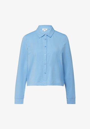 Chemise courte à manches longues bleu clair avec col et boutons sur le devant, présentée sur un fond blanc.