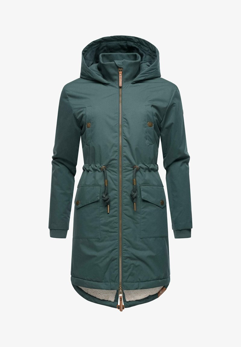 Zaļa, mīksta jaka ar kapuci, ar priekšējo rāvējslēdzēju, regulējamu stringa vidukli, divām priekšējām kabatām un iebūvētiem aprocēm. iekšpusē ar vilnas oderi.