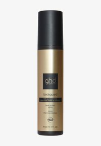 Bouteille de pulvérisation dorée et noire étiquetée "ghd bodyguard", 120 ml. Présente une forme ronde, une texture lisse et un texte clair indiquant la protection contre la chaleur.