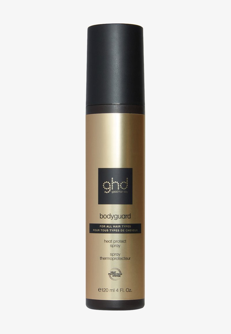 Bouteille de pulvérisation dorée et noire étiquetée "ghd bodyguard", 120 ml. Présente une forme ronde, une texture lisse et un texte clair indiquant la protection contre la chaleur.