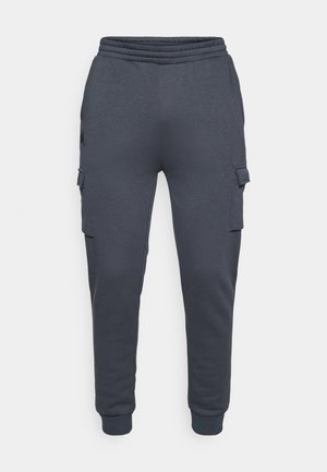Mörkgrå sweatpants gjorda av mjukt tyg, med en tapered ben-design och sidofickor med lock. Elastisk midja ingår.