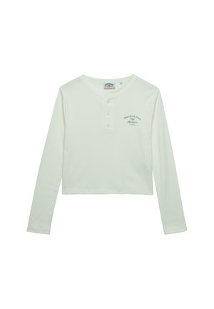 Crèmekleurig henley-shirt met lange mouwen, drie knopen en kleine tekst "New York State 1986 Athletics" op de linkerborst.