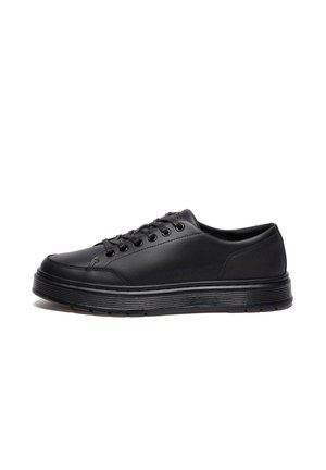 Black low-top sneakers made of smooth synthetic material, featuring round laces, six eyelets, and a textured rubber sole with white accents.