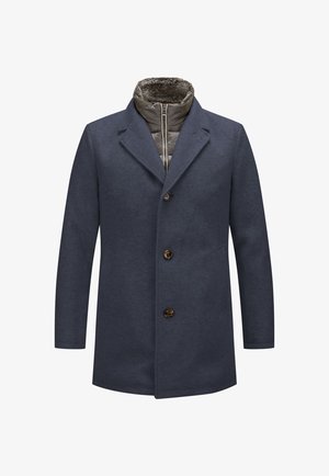 Marineblaue Jacke mit Reverskragen, Knopfverschluss und einem mit Fell gefütterten Kragen. Verfügt über ein gestepptes Innenfutter mit einem Reißverschluss.