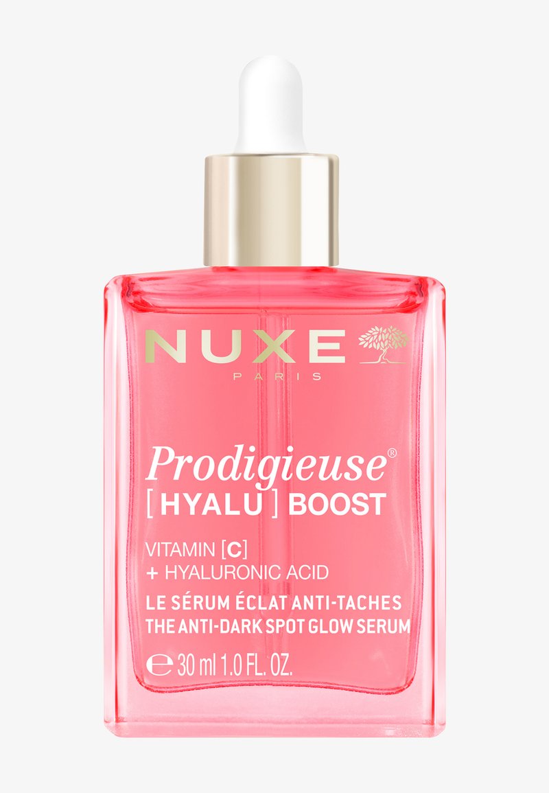 Flesje Nuxe Prodigieuse Hyalu Boost serum met druppelaar, roze vloeistof, gelabeld met Vitamine C en hyaluronzuur voor anti-donkerevlekken glans, 30 ml.