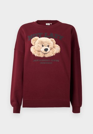 Bordo dukserica s grafikom teddy bear i natpisima "NISAM LENJ" i "SAMO SAM U MODU ŠTEDNJE ENERGIJE" sprijeda, dugački rukavi, rebrasti manžeti.
