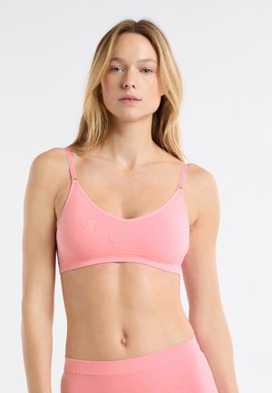 Rosa Bralette aus weichem Stoff mit verstellbaren Trägern und breitem Bund. Glatte Textur, minimales Design und keine sichtbaren Verschlüsse.