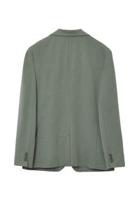 Blazer verde in tessuto testurizzato, con revers a pullover, venti singoli e polsini con bottone. Il retro è semplice, senza tasche visibili.