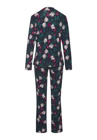 Bloemenprint pak met een donkerblauwe achtergrond en grote witte en roze bloemen, gecombineerd met bijpassende broek, ontworpen met een getailleerde silhoutte.