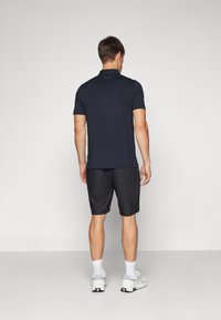 TravisMathew WANDERLUST SHORT - Sporta šorti - black