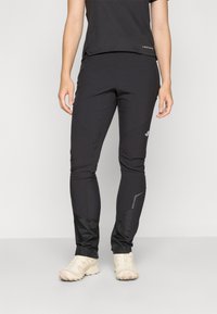Black lightweight athletic pants featuring a tapered fit, elastic waistband, and reflective accents on the sides for visibility.