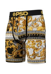 Boxers negros y dorados con intrincados patrones dorados, cadenas y acentos de clave griega sobre un fondo blanco. Cintura elástica visible.