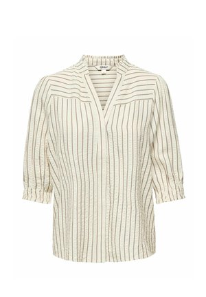 Krēmīgi krēmveida blūze ar vertikālām brūnām svītrām, 3/4 savilktu piedurknēm un V veida izgriezumu ar mazu apkaklīti, attēlota uz baltas fona.