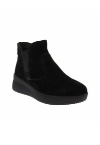 Stivale alla caviglia in suede nero con pannelli elastici laterali, punta arrotondata e suola in gomma testurizzata. Design semplice con minimi dettagli di cucitura.
