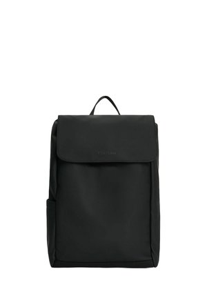 Black nylon backpack with a fold-over flap, a top handle, and side pocket. Features a smooth texture and minimalist design.
