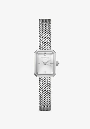 Silver rectangular watch with a textured white dial, octagonal frame, and mesh strap. Features minimalist hour markers and a side crown.