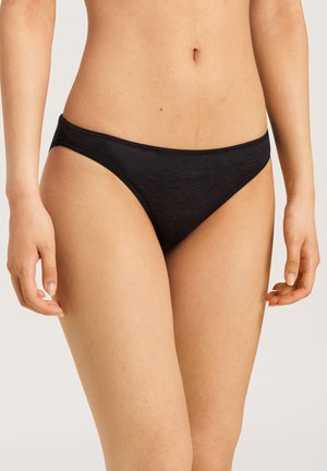 Black bikini bottoms with a low-rise design, made from soft, smooth fabric featuring minimal stitching and no visible hardware.