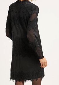 Cream Jerseyklänning - black