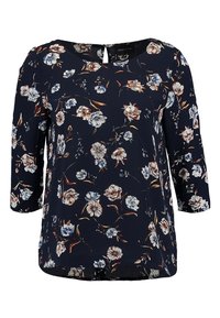 Marinebluse mit drei Viertelärmeln, floralem Muster in Weiß, Blau und Rost, Rundhalsausschnitt und einem Schlitzdetail hinten.