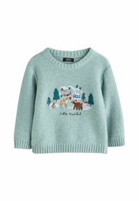 Pull vert clair avec un col rond et un ourlet côtelé. Présente une scène forestière colorée brodée avec des animaux et le texte "Feliz Navidad."