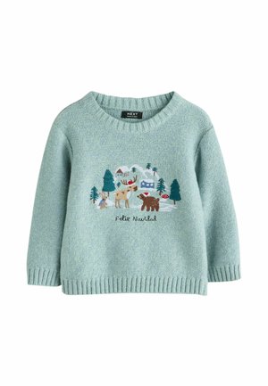 Pull vert clair avec un col rond et un ourlet côtelé. Présente une scène forestière colorée brodée avec des animaux et le texte "Feliz Navidad."