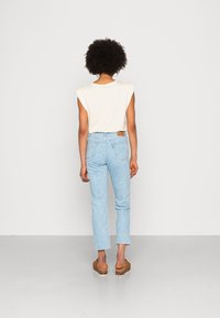 Levi's® CROP - Calças de ganga de perna direita - blue pattern